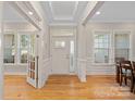 Bright entryway with hardwood floors, white trim, and ample natural light streaming through large windows at 114 Canoe Pole Ln, Mooresville, NC 28117