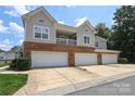 Spacious townhome with a multi-car garage and a second-story balcony at 12321 Aquitaine St, Charlotte, NC 28277