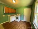 Functional kitchen with essential appliances, practical layout, and ample countertop space at 1824 Maribel Ave, Charlotte, NC 28216