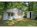 Exterior view of storage shed with awning, offering additional outdoor storage and utility at 2500 Kendrick Dr, Charlotte, NC 28214