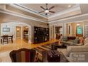 Spacious living room with hardwood floors, tray ceiling, and seamless flow to dining and kitchen at 2590 Berne Ln, Sherrills Ford, NC 28673