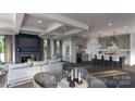 Open concept living space features coffered ceilings and seamless flow into the gourmet kitchen at 309 S Gardner Ave, Charlotte, NC 28208