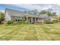 Beautiful brick home with lush landscaping, showcasing a well-kept lawn and inviting curb appeal at 314 Candella Dr, Matthews, NC 28104