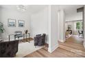 Bright home office featuring a glass desk, comfortable chairs, and natural light at 384 Speedway Pl, Concord, NC 28027