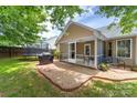 Inviting backyard with a screened-in porch, patio, and fenced yard at 4321 Timberwood Dr, Gastonia, NC 28056