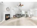 Bright living room featuring a fireplace, vaulted ceiling, and ample seating at 4321 Timberwood Dr, Gastonia, NC 28056