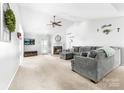 Cozy living room with a fireplace, large sectional sofa, and neutral décor at 4321 Timberwood Dr, Gastonia, NC 28056