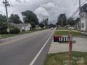 Street view showcasing the neighborhood with well-maintained homes and tree-lined streets at 1017 W C St, Kannapolis, NC 28081