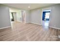 Spacious living room featuring durable wood flooring and neutral wall paint at 1020 N Ransom St, Gastonia, NC 28052