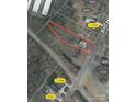 Aerial view of property with outlined lot, showcasing proximity to neighborhood and street at 1419 Richland Dr, Charlotte, NC 28205