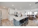 Open-concept kitchen featuring a center island with bar seating and a view to the dining room at 150 Bezelle Ave, York, SC 29745