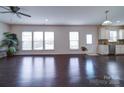 Spacious living room with hardwood floors and natural light flowing through large windows at 3009 Palm Dr, Fort Mill, SC 29715