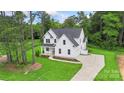Charming two-story home with a well-manicured lawn, inviting entrance and plenty of curb appeal at 3222 Player Ct, Salisbury, NC 28144