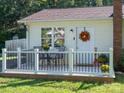 Charming covered porch with a table and chairs, perfect for enjoying the outdoors at 327 Downing St, Troutman, NC 28166