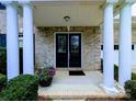 Inviting front entrance with double doors, white pillars, and a decorative potted flower arrangement at 408 Presidio Dr, Rock Hill, SC 29732