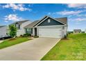 Attractive home with a concrete driveway and landscaping at 410 Apex Cir, Shelby, NC 28152