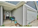 Inviting front porch with seating and a well-maintained entrance at 410 Apex Cir, Shelby, NC 28152