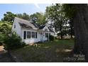 Lovely one-story home with a welcoming front porch and mature trees at 506 Linwood Rd, Gastonia, NC 28052