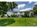 Charming townhouse with manicured lawn, mature trees, and classic architectural details at 528 Wakefield Dr # A, Charlotte, NC 28209