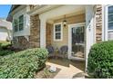 Inviting front porch with seating, decorative accents, and a welcoming entrance at 529 River Park Rd, Belmont, NC 28012