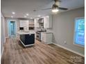 Bright kitchen with an island, stainless steel appliances, granite counters and lots of storage at 616 Laurel St, Albemarle, NC 28001