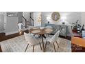 Cozy dining room features a round table, stylish chairs, and a decorative buffet, perfect for intimate gatherings at 6733 Candlewood Dr, Charlotte, NC 28210