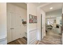Hallway with wood floors leading into the dining room and living space at 8042 Saluda Dr # 3, Charlotte, NC 28269