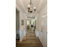 Elegant hallway with beautiful hardwood floors and charming lighting at 8042 Saluda Dr # 3, Charlotte, NC 28269