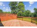 Spacious wooden deck showcasing sturdy railings and ample room for outdoor furniture and gatherings at 8706 Richardson King Rd, Waxhaw, NC 28173