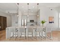 Bright kitchen with large island, stainless steel appliances, and stylish pendant lighting at 1315 East Blvd # 225, Charlotte, NC 28203