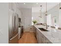 Modern kitchen with stainless steel appliances, a large island, and ample cabinet space at 1315 East Blvd # 225, Charlotte, NC 28203