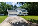 Classic two-story home with an attached two-car garage and driveway at 1636 Springwinds Dr, Rock Hill, SC 29730