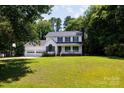 Two-story home with an attached two-car garage and a well-manicured front yard at 1636 Springwinds Dr, Rock Hill, SC 29730