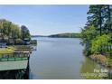 Scenic waterfront view with boat docks and a glimpse of the serene lake at 177 Mountain View Ln, Troy, NC 27371