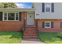 Inviting entrance with a classic brick staircase leading to the front door of this charming home at 2000 Townsend Ave, Charlotte, NC 28205