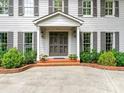 Inviting home featuring a stylish front door with decorative shrubbery at 2141 Halford Pl, Charlotte, NC 28211