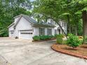 Two car attached garage with beautiful landscaping on a well maintained lot at 2141 Halford Pl, Charlotte, NC 28211