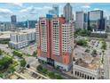 External view of 222 S Caldwell Street #2203 and surrounding cityscape under a bright blue sky at 222 S Caldwell St # 2203, Charlotte, NC 28202
