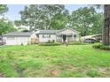 Wide view of a well maintained single-story home with detached garage at 2279 Cedar Oak Cir, Gastonia, NC 28052