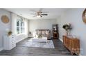 Bright living room with modern decor, wood flooring, a comfortable sofa, and a large window with natural light at 360 Sexton St, Kannapolis, NC 28081