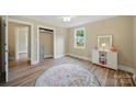 Cozy bedroom showcasing natural light, modern flooring, neutral walls, and ample closet space at 407 Cummings St, Rock Hill, SC 29730