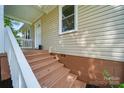 Exterior steps with brown painted base leading up to the front door and porch at 407 Cummings St, Rock Hill, SC 29730