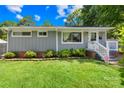 Lovely home with gray siding, white trim, and manicured landscaping, creating a welcoming curb appeal at 411 Belvedere Cir, Kings Mountain, NC 28086