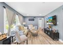 Inviting living room with wood floors, a cozy sofa, and entertainment center with a television at 411 Belvedere Cir, Kings Mountain, NC 28086