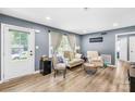 Cozy living room features wood floors, a large window with natural light, and comfortable seating at 411 Belvedere Cir, Kings Mountain, NC 28086