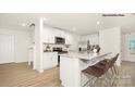Bright kitchen featuring white cabinets, granite countertops, stainless steel appliances and a breakfast bar at 444 Court House Ave, York, SC 29745