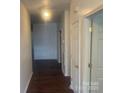 Inviting hallway with wood floors leading to various rooms in the home at 4454 Glenlea Commons Dr, Charlotte, NC 28216