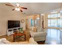 Spacious living room with hardwood floors and a cozy seating arrangement at 7521 Plumcrest Ln, Harrisburg, NC 28075