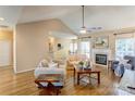 Inviting living room with fireplace, neutral tones, and hardwood flooring at 7521 Plumcrest Ln, Harrisburg, NC 28075
