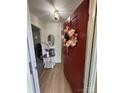 Inviting foyer with a wood floor, decorative wreath, and stylish accents, creating a warm and welcoming entrance at 8322 Summerglen Cir, Charlotte, NC 28227